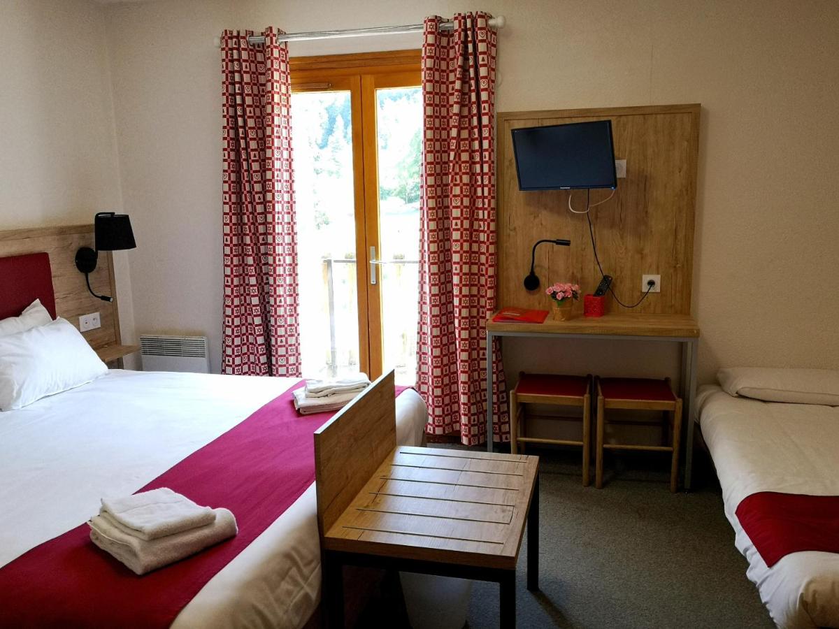 Un ou plusieurs lits dans un hébergement de l'établissement Hôtel Espace Montclar