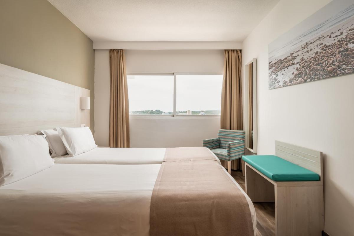 Cama o camas de una habitación en Apartamentos Vistasol