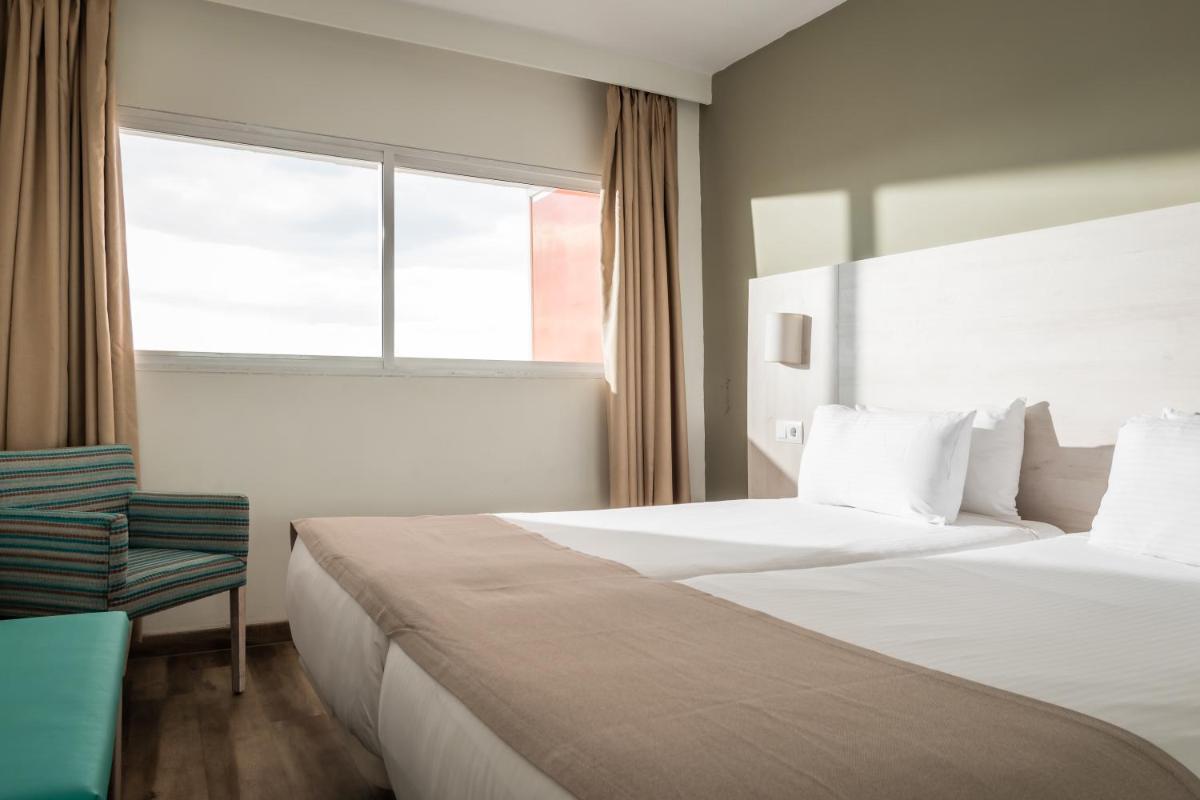 Cama o camas de una habitación en Apartamentos Vistasol