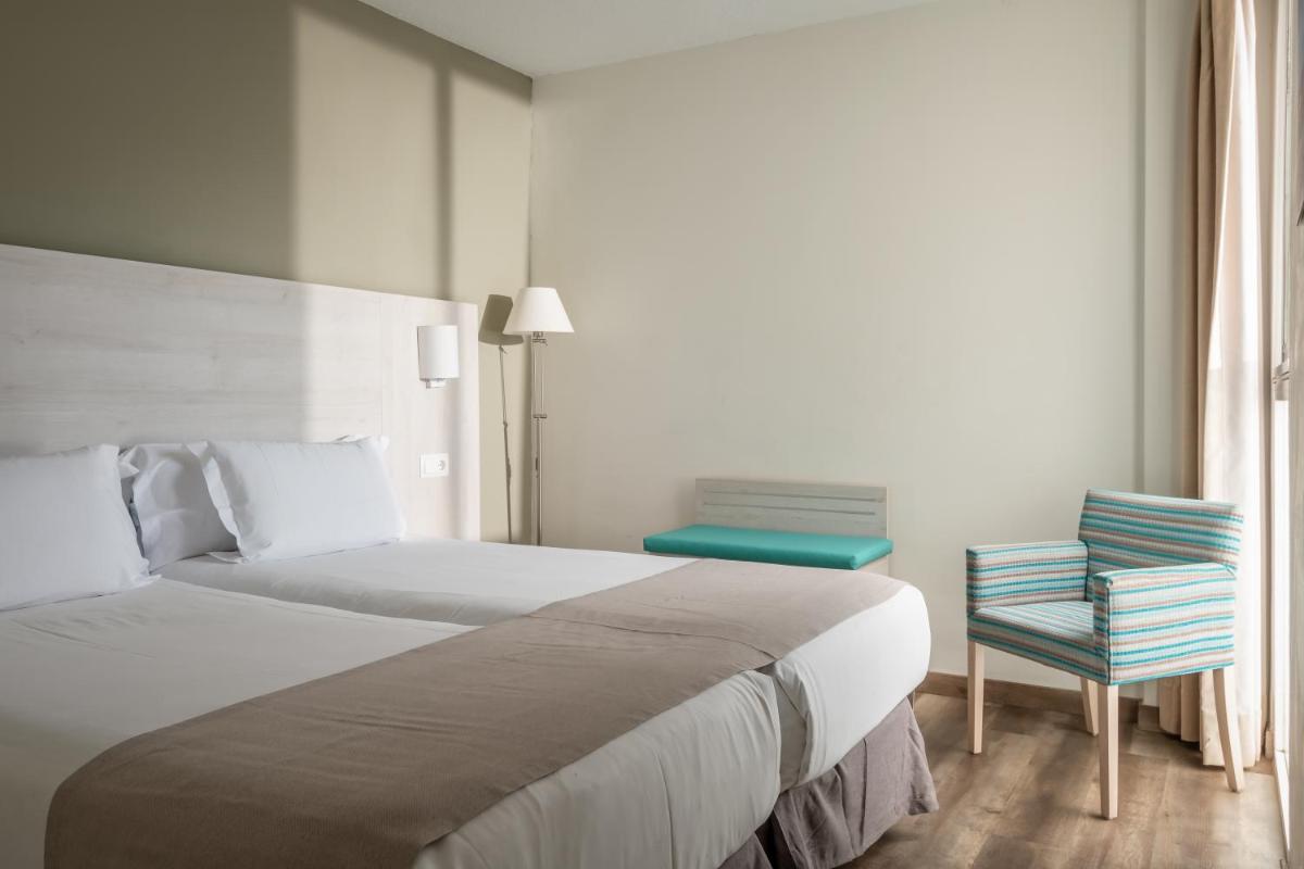 Cama o camas de una habitación en Apartamentos Vistasol