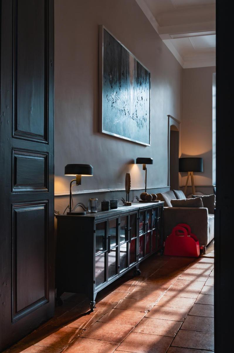 Un ou plusieurs lits dans un hébergement de l'établissement Le Monastère de Saint Mont Hôtel & Spa