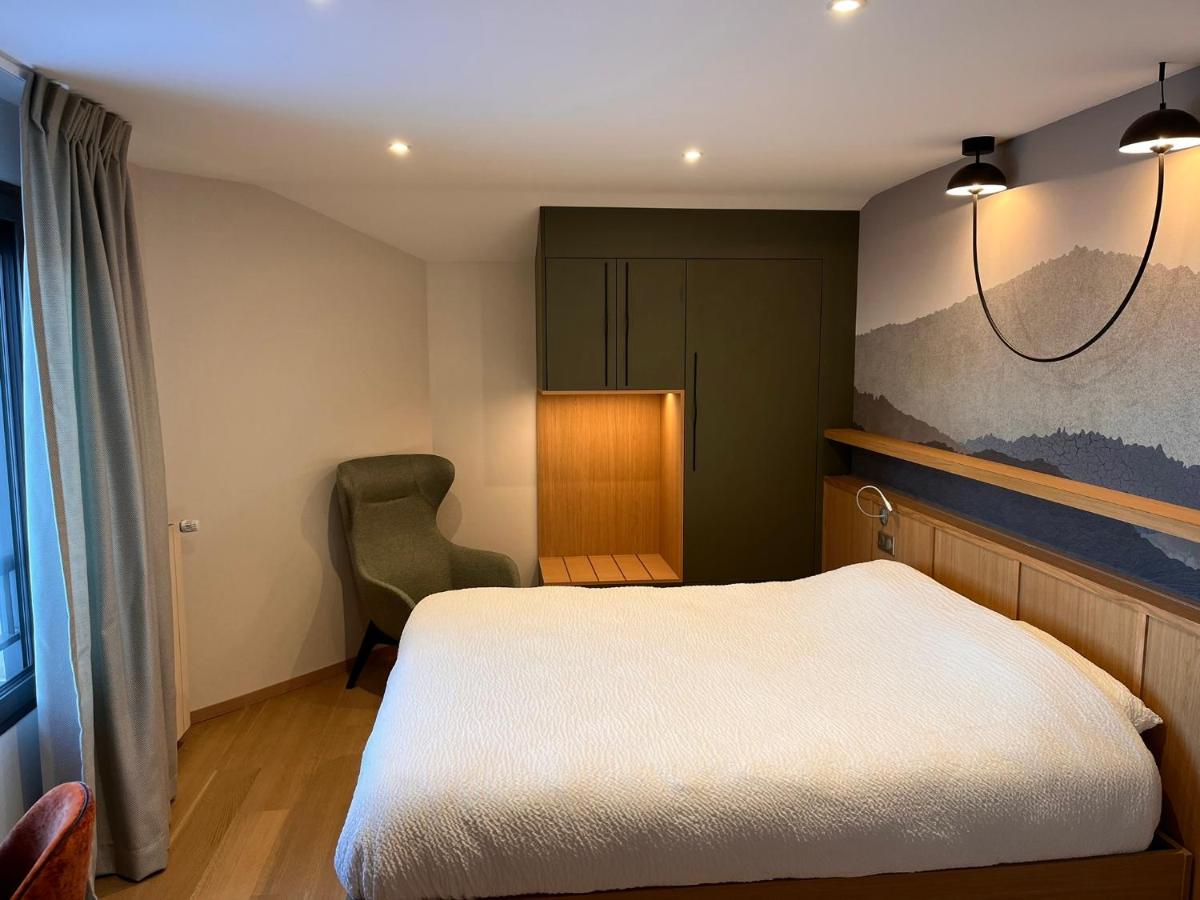 Un ou plusieurs lits dans un hébergement de l'établissement Logis Hotel Spa Restaurant Le Provence