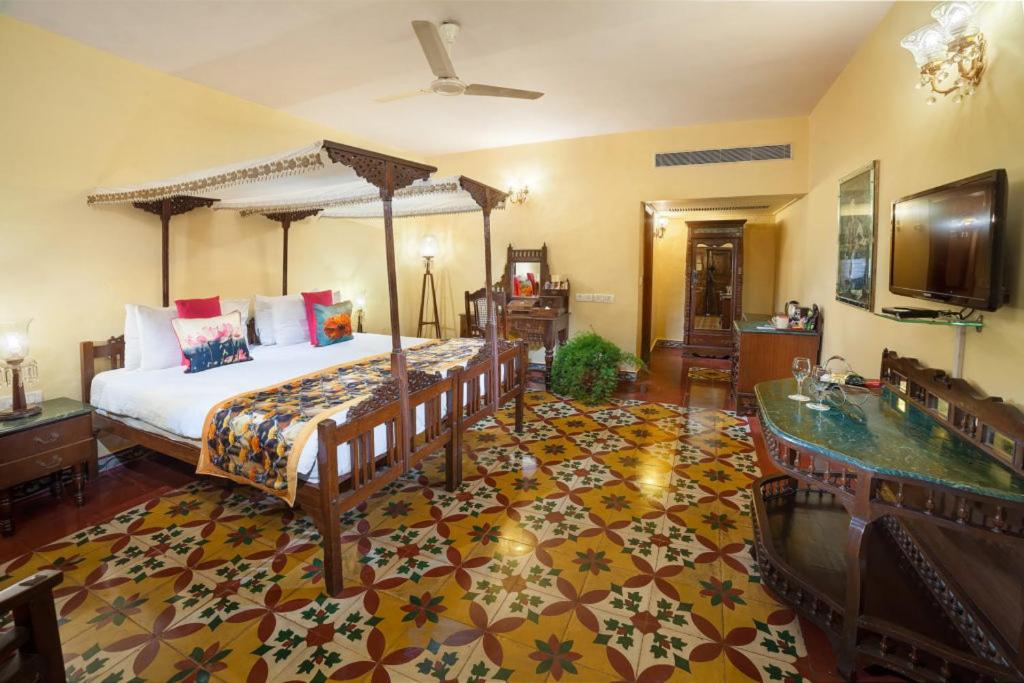 a bedroom with a bed and a tub in a room at The Grand Imperial - Heritage Hotel in Agra