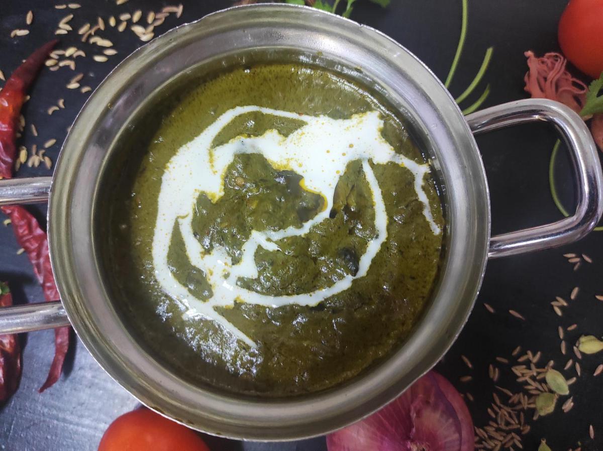 a pot of sauce with vegetables and tomatoes at Novotel Kolkata Hotel and Residences in Kolkata a pot of sauce with vegetables and tomatoes at Novotel Kolkata Hotel and Residences in Kolkata