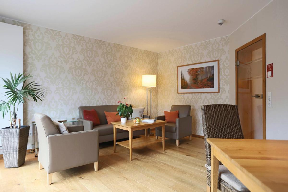 Ein Sitzbereich in der Unterkunft Hotel Deimann