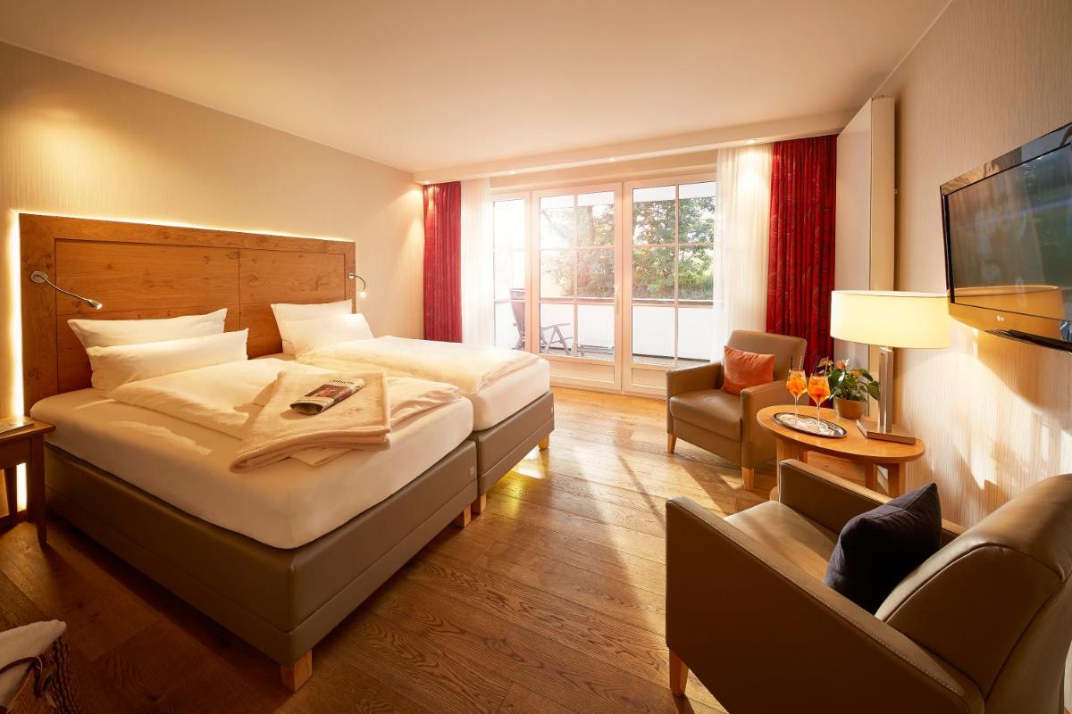 Ein Bett oder Betten in einem Zimmer der Unterkunft Hotel Deimann