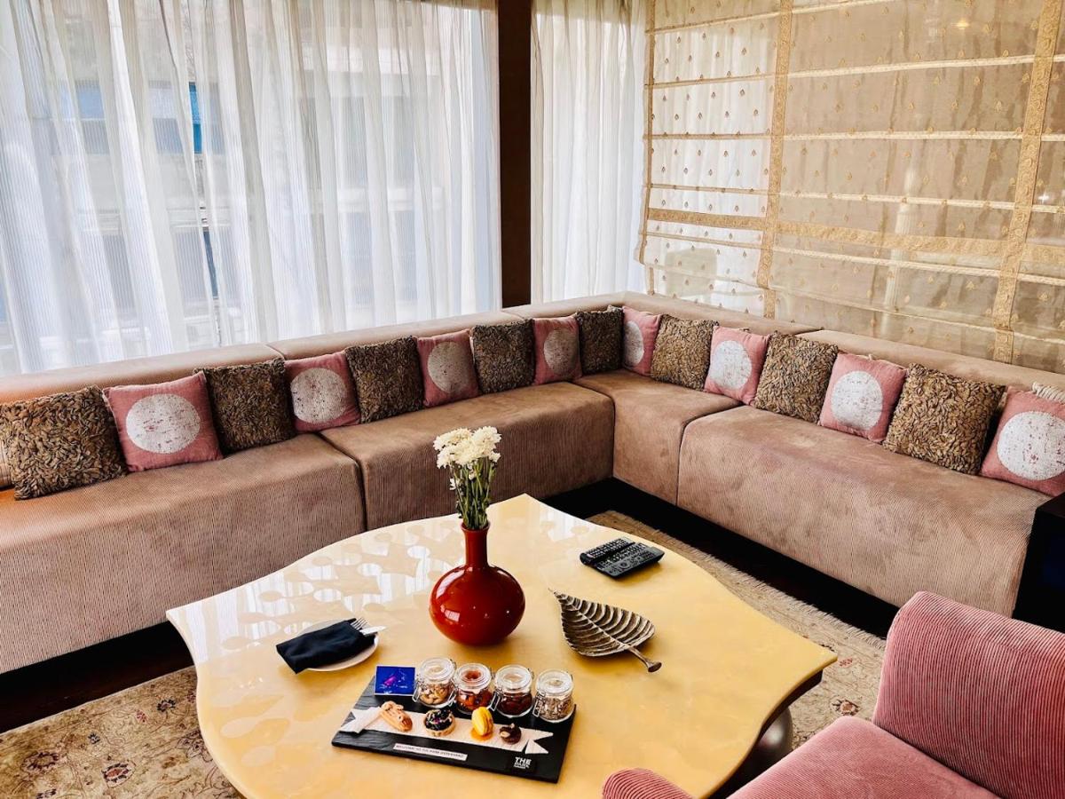 a living room with a couch and a coffee table at The Park Hyderabad, Banjara Hills near Hussain Sagar Lake in Hyderabad a living room with a couch and a coffee table at The Park Hyderabad, Banjara Hills near Hussain Sagar Lake in Hyderabad