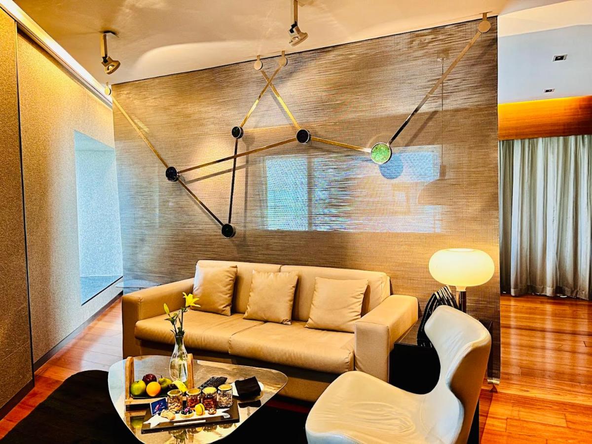 a living room with a couch and a table at The Park Hyderabad, Banjara Hills near Hussain Sagar Lake in Hyderabad a living room with a couch and a table at The Park Hyderabad, Banjara Hills near Hussain Sagar Lake in Hyderabad