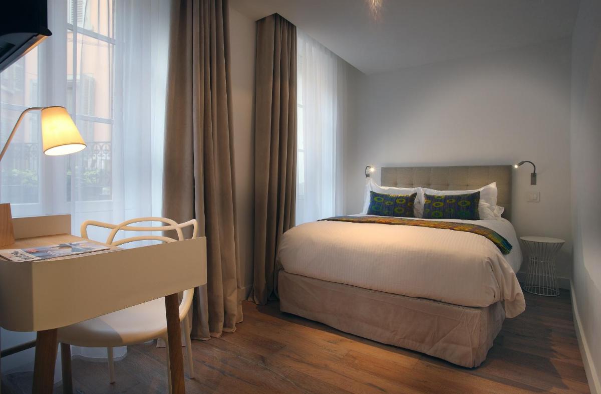 Un ou plusieurs lits dans un hébergement de l'établissement Petit Hôtel Confidentiel