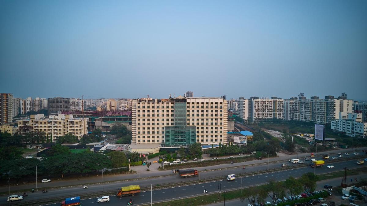 a view of a city with a highway and buildings at Sayaji Pune in Pune
