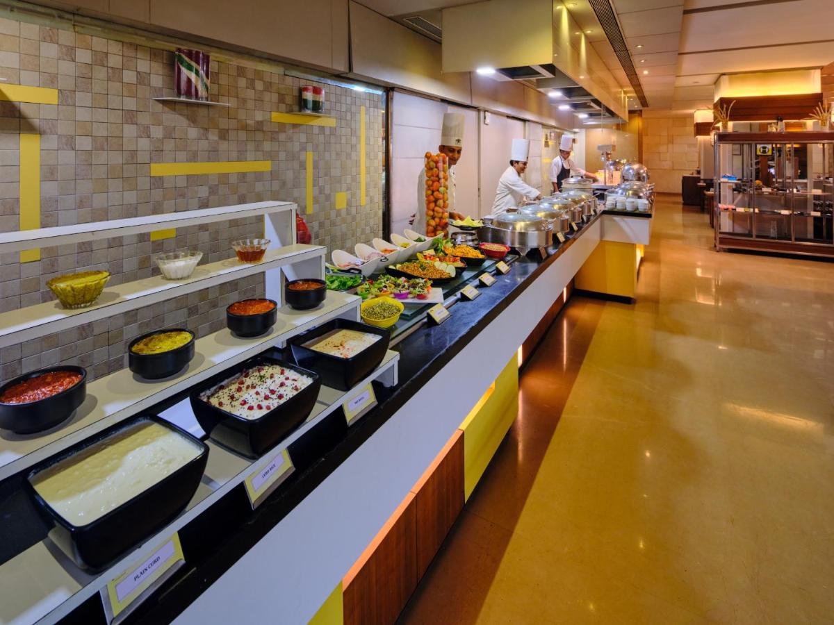 a buffet line with many different types of food at Sayaji Pune in Pune