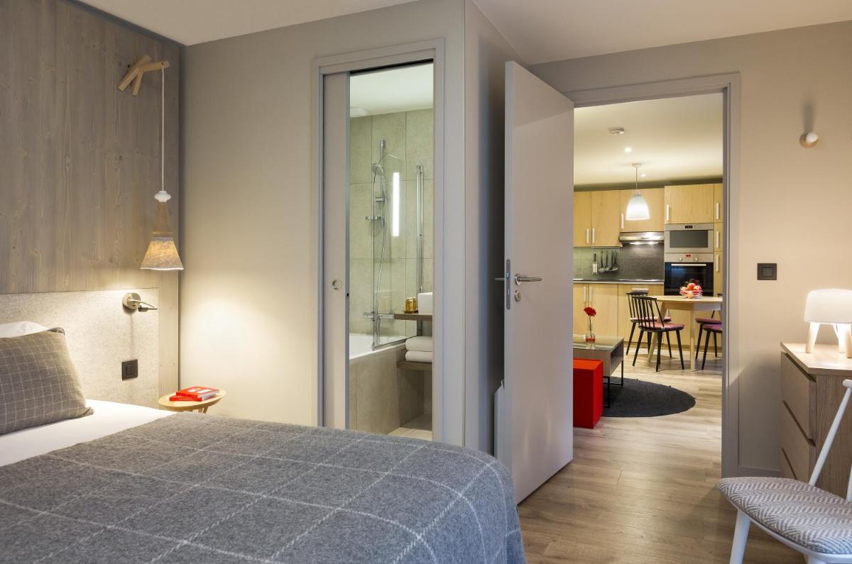 Un ou plusieurs lits dans un hébergement de l'établissement Appartements de l'Héliopic