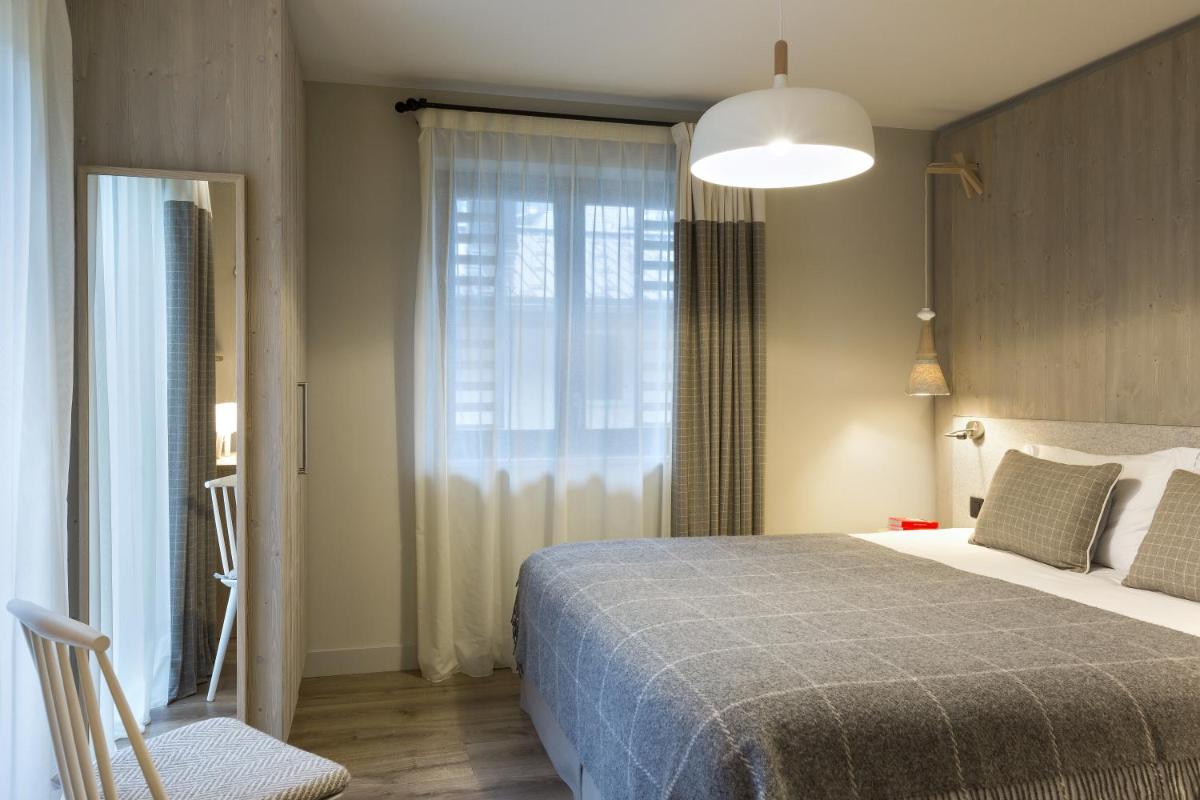 Un ou plusieurs lits dans un hébergement de l'établissement Appartements de l'Héliopic