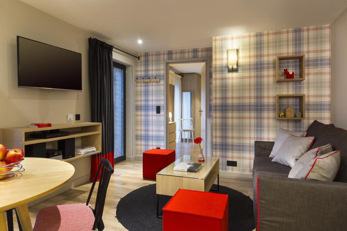 Coin salon dans l'établissement Appartements de l'Héliopic
