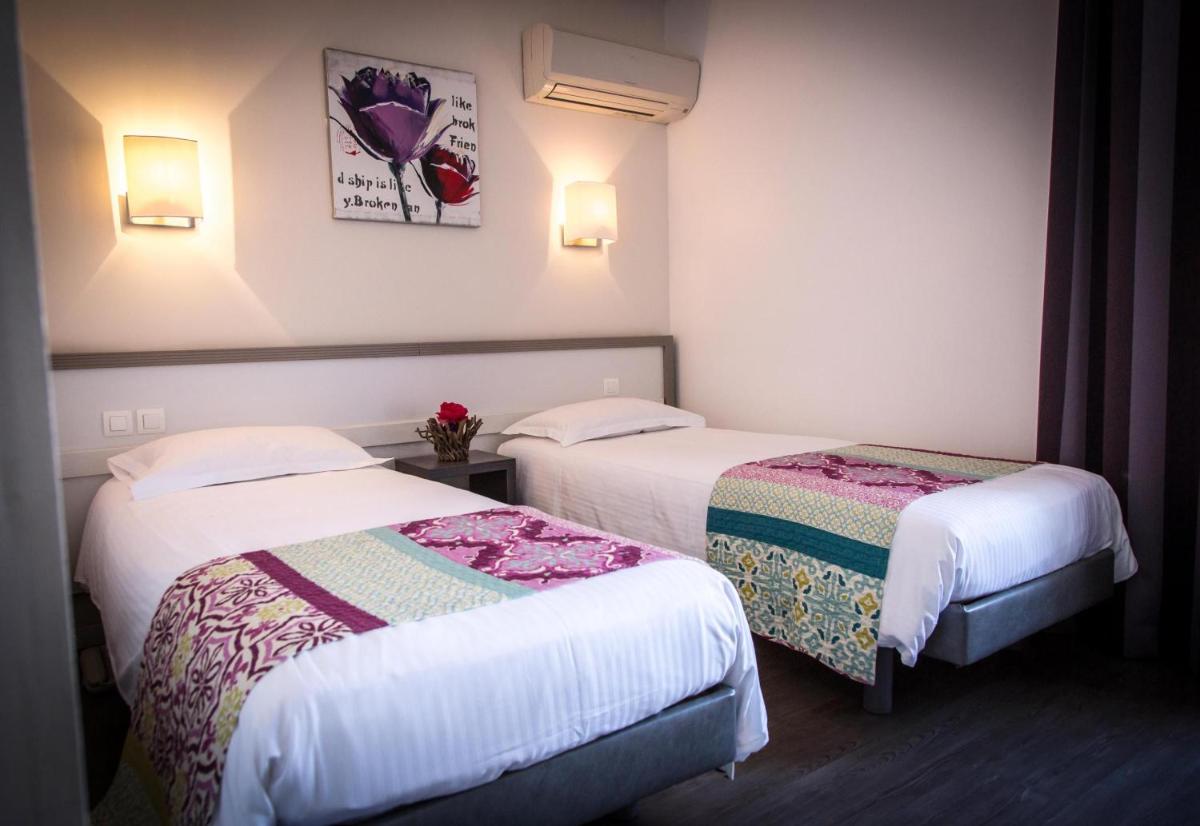 Un ou plusieurs lits dans un hébergement de l'établissement Golfe Hôtel & Spa Porto-Vecchio