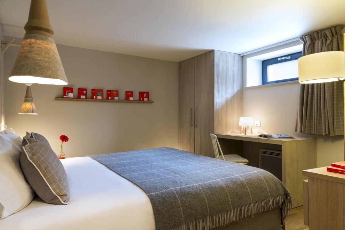Un ou plusieurs lits dans un hébergement de l'établissement Appartements de l'Héliopic