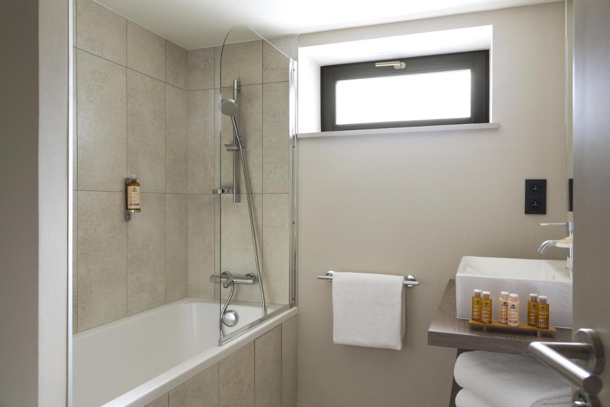 Salle de bains dans l'établissement Appartements de l'Héliopic