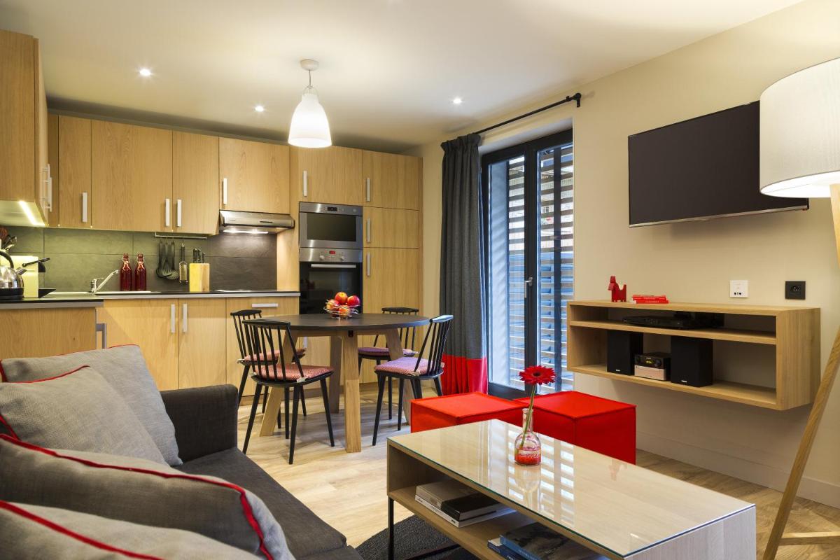 Cuisine ou kitchenette dans l'établissement Appartements de l'Héliopic