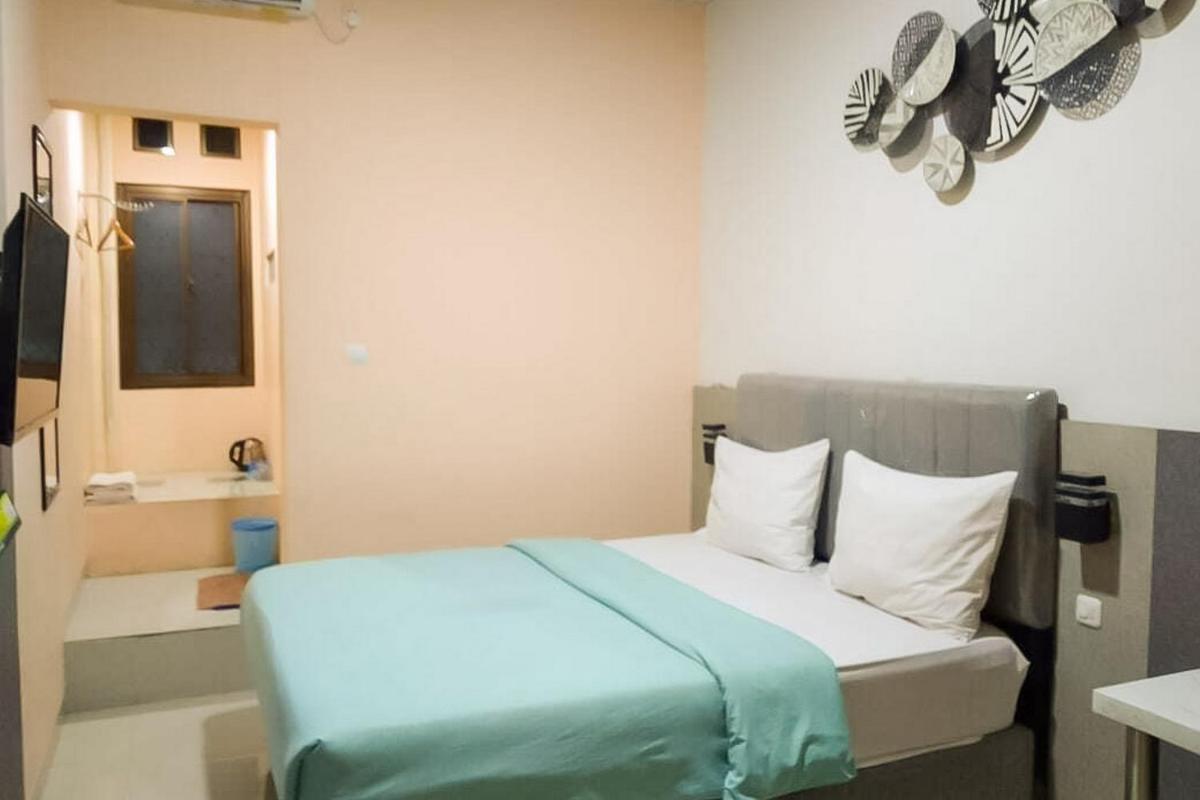 Urbanview Hotel Delima 101 Syariah - Housity