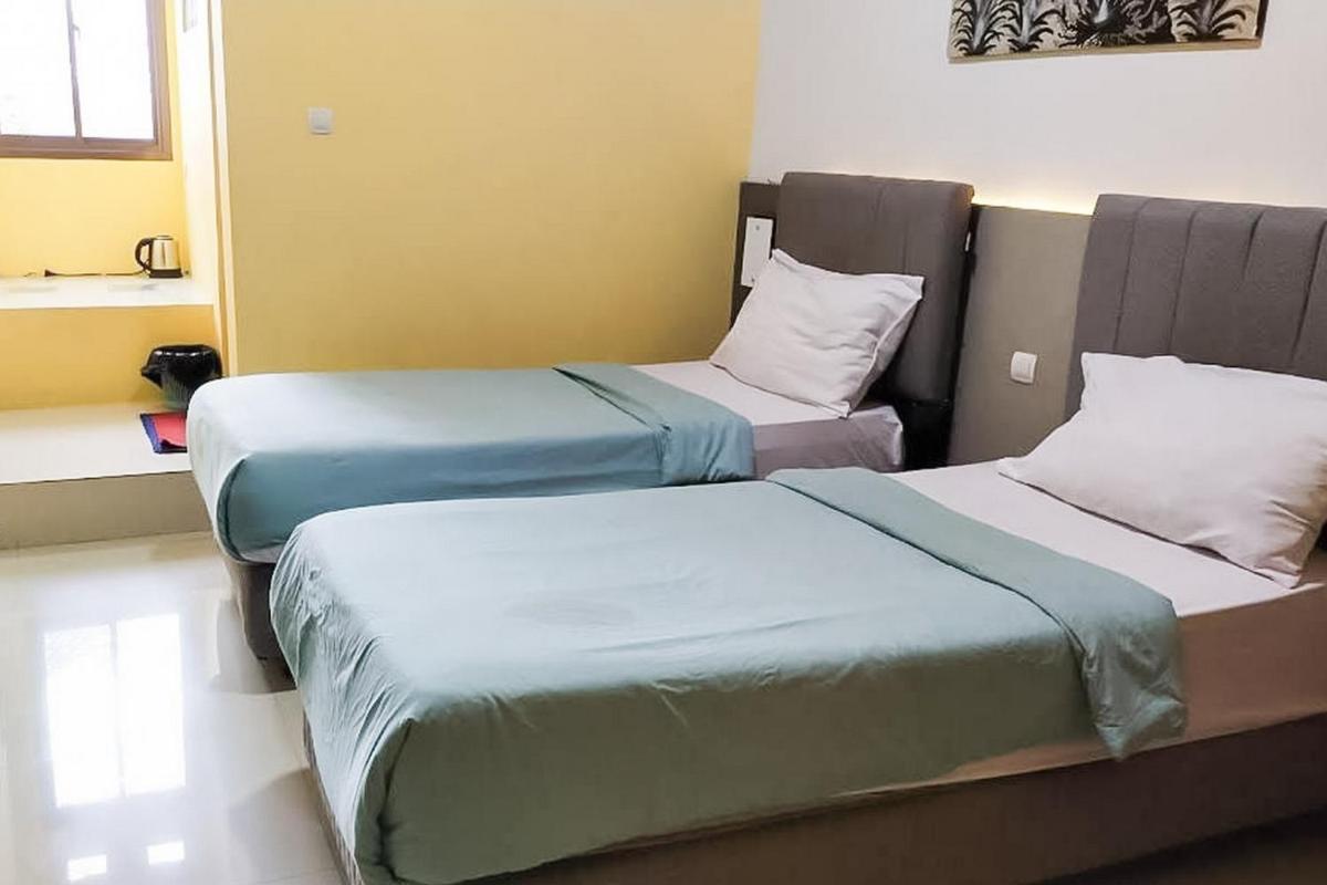 Urbanview Hotel Delima 101 Syariah - Housity