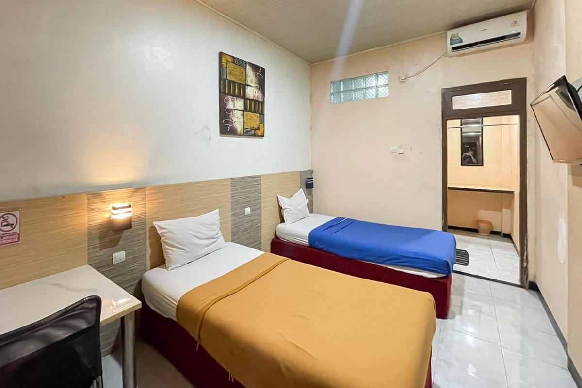 Urbanview Hotel Delima 101 Syariah - Housity