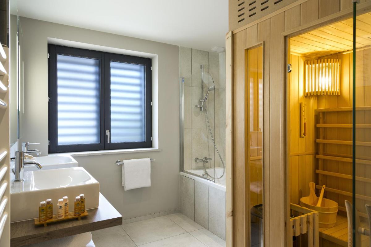 Salle de bains dans l'établissement Appartements de l'Héliopic