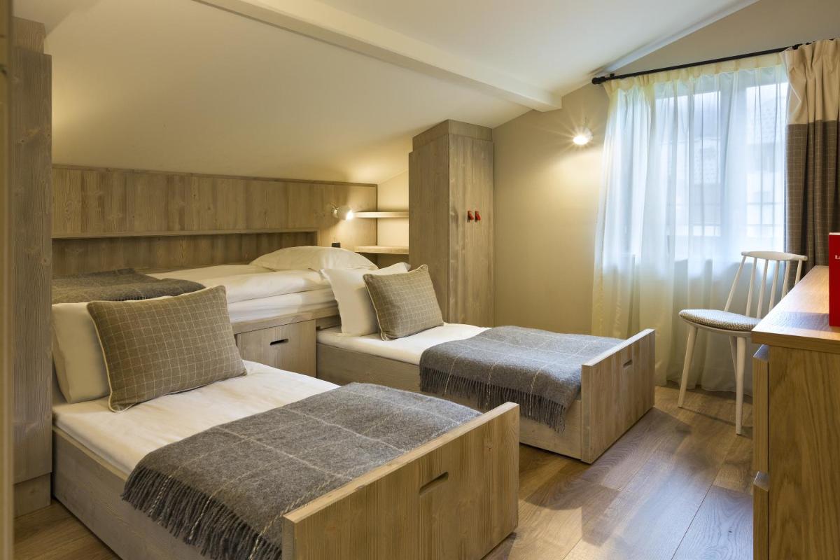 Un ou plusieurs lits dans un hébergement de l'établissement Appartements de l'Héliopic