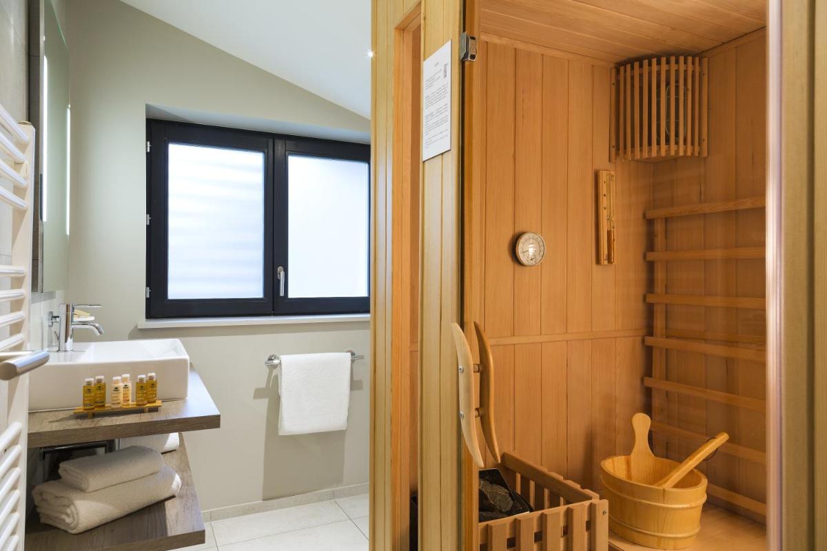 Salle de bains dans l'établissement Appartements de l'Héliopic