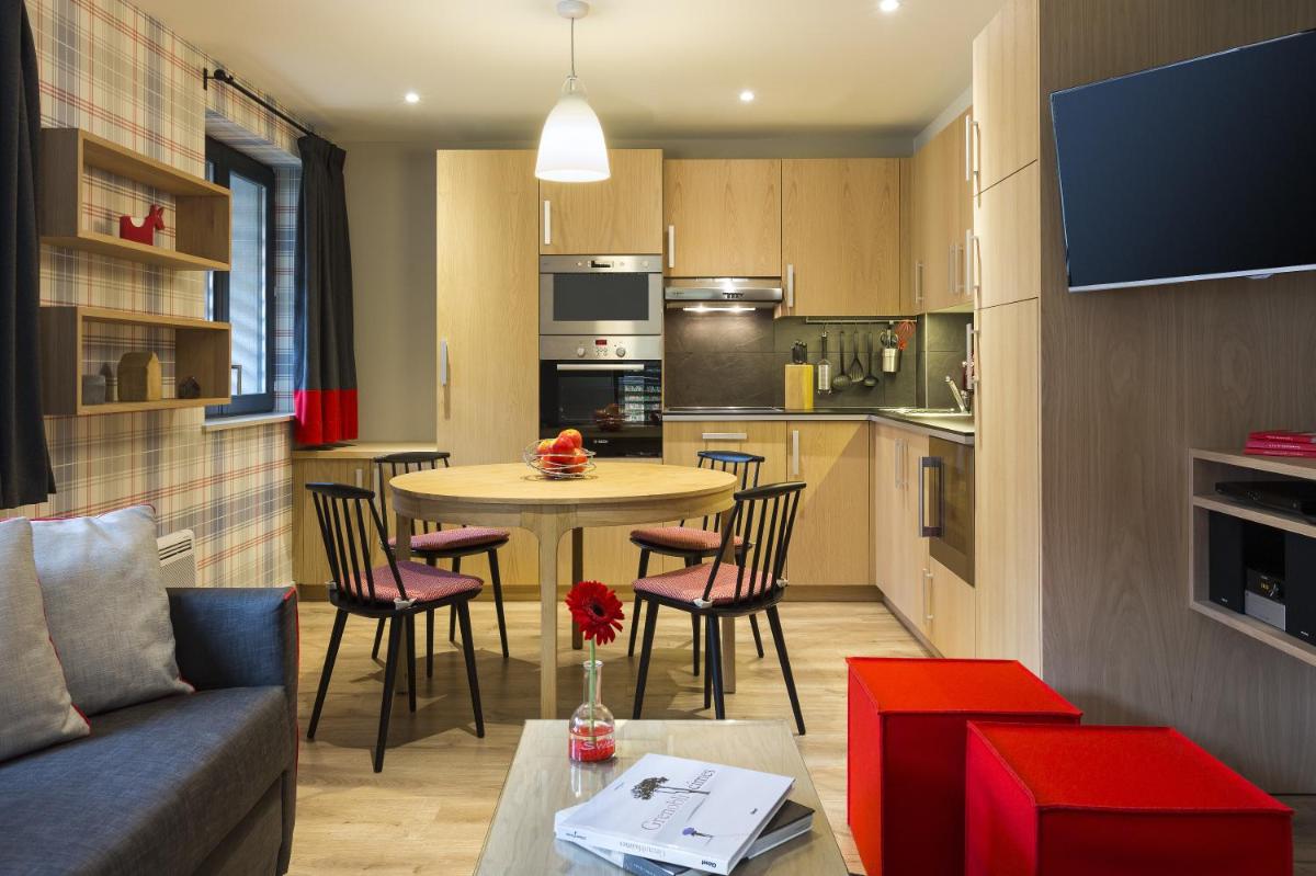 Cuisine ou kitchenette dans l'établissement Appartements de l'Héliopic