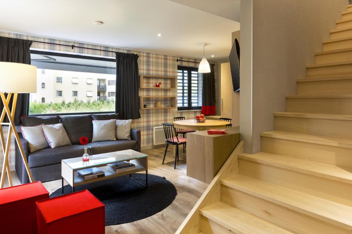 Coin salon dans l'établissement Appartements de l'Héliopic