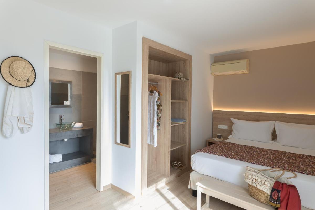 Un ou plusieurs lits dans un hébergement de l'établissement Golfe Hôtel & Spa Porto-Vecchio