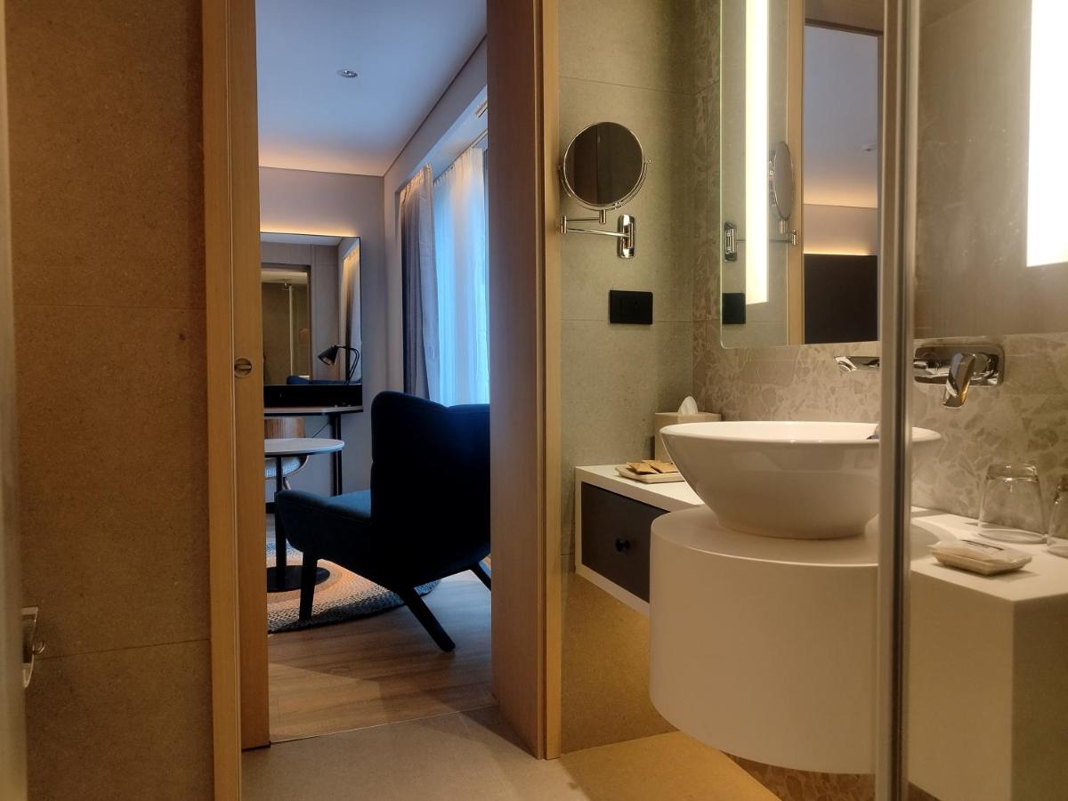 a bathroom with a sink and a mirror at Hyatt Centric Hebbal Bengaluru in Bengaluru