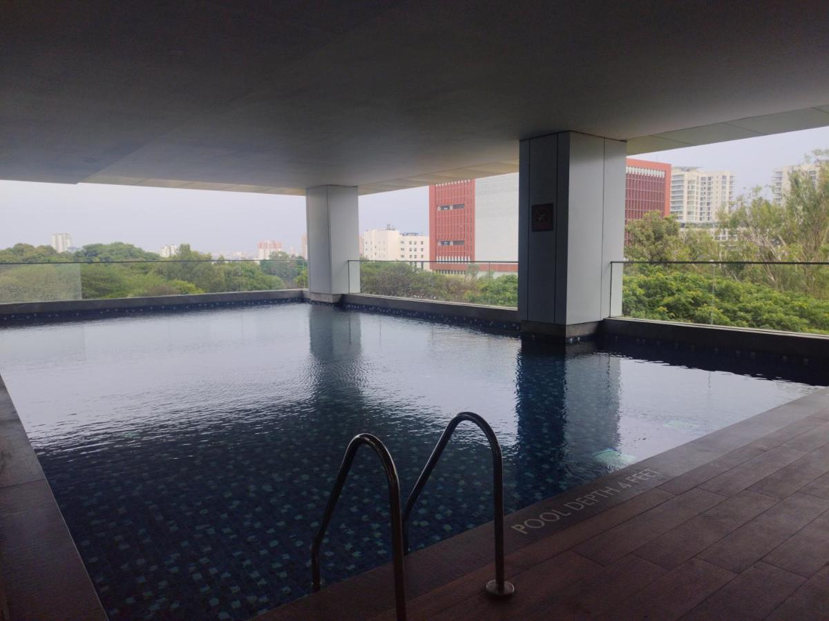 a swimming pool in the middle of a building at Hyatt Centric Hebbal Bengaluru in Bengaluru