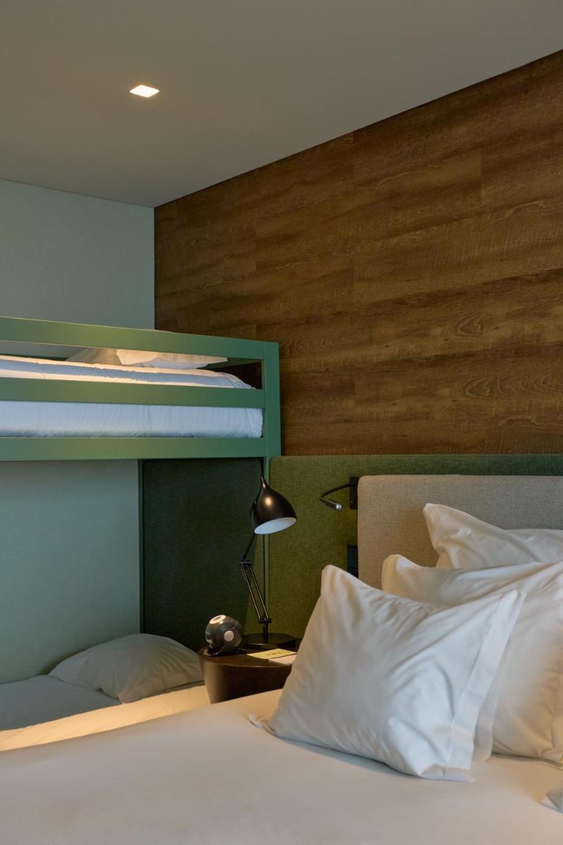 Uma cama ou camas num quarto em Octant Ponta Delgada
