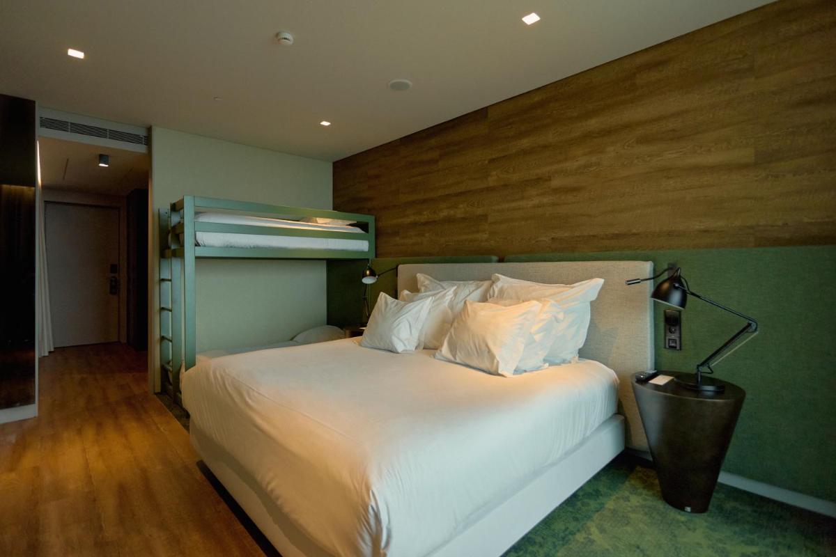 Uma cama ou camas num quarto em Octant Ponta Delgada