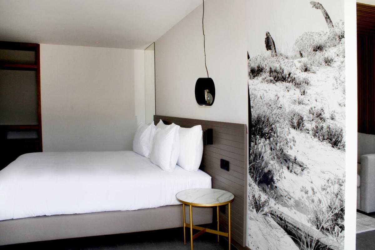 Uma cama ou camas num quarto em AP Cabanas Beach & Nature - Adults Friendly