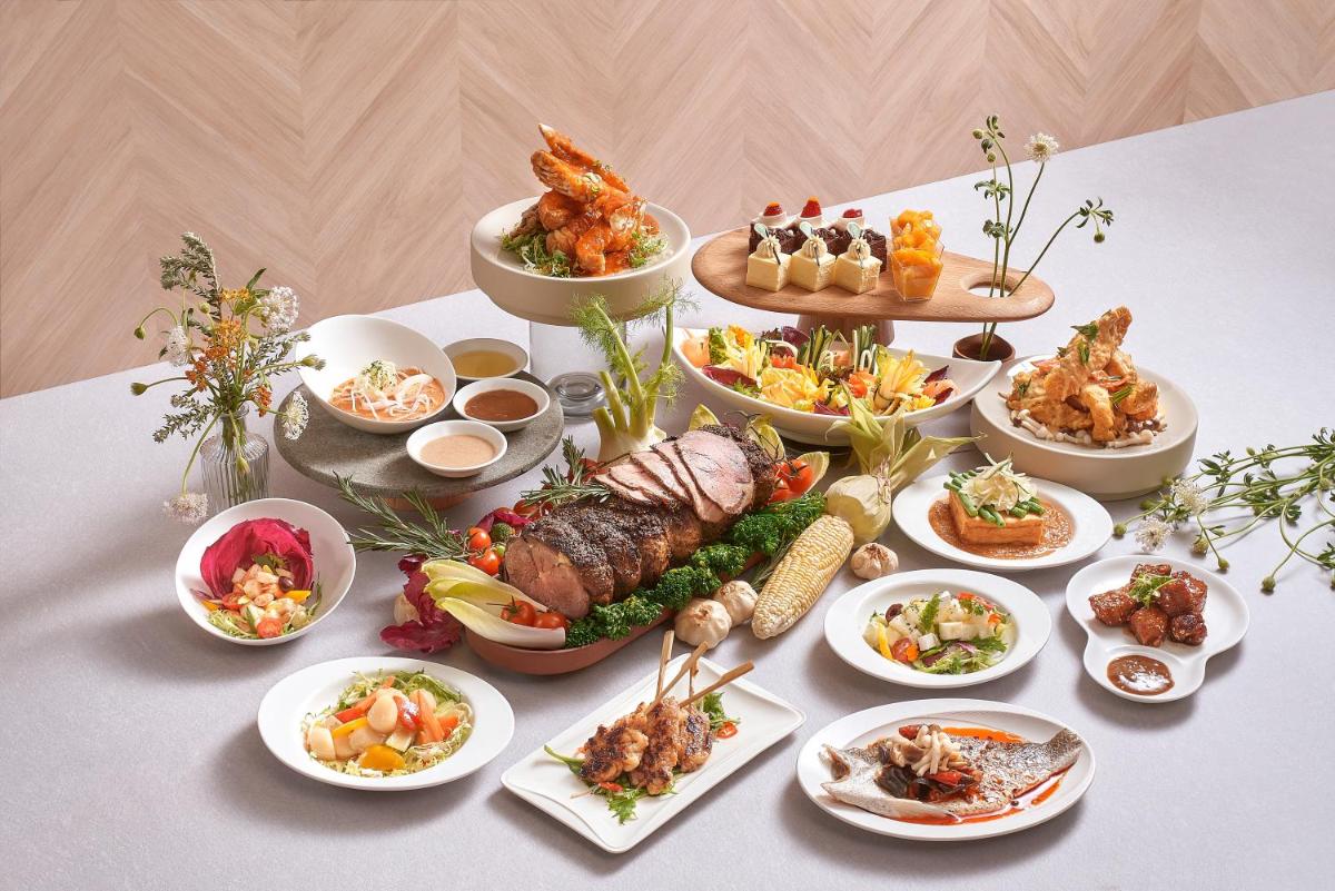 a table with many different dishes of food on it at Carlton Hotel Singapore in Singapore a table with many different dishes of food on it at Carlton Hotel Singapore in Singapore