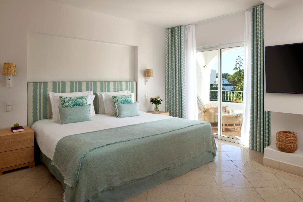 Uma cama ou camas num quarto em Vila Vita Parc