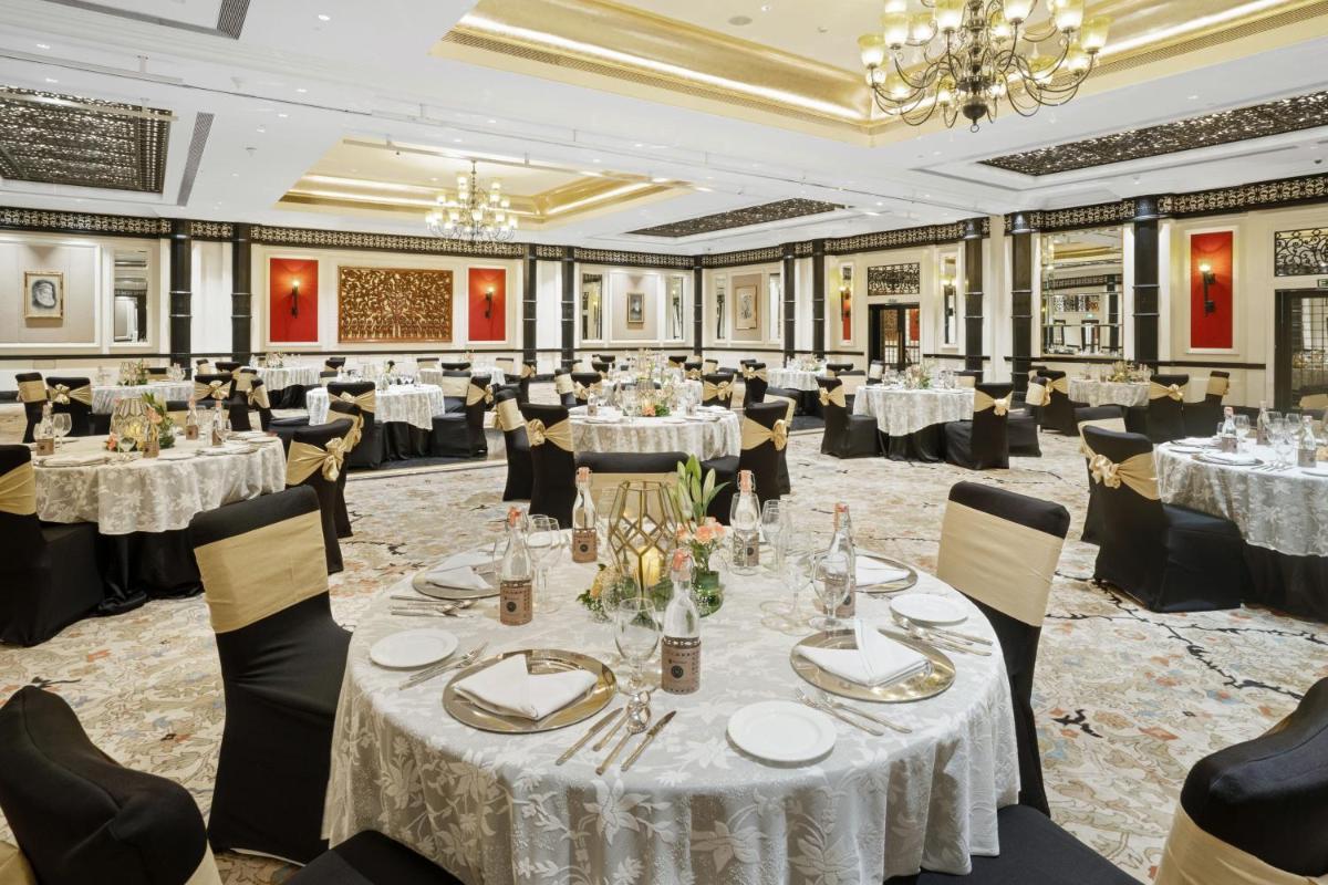 a banquet hall with tables and chairs and a chandelier at ITC Maratha, a Luxury Collection Hotel, Mumbai in Mumbai
