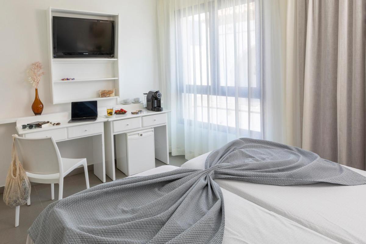 Cama o camas de una habitación en Hotel Spa Cap de Creus