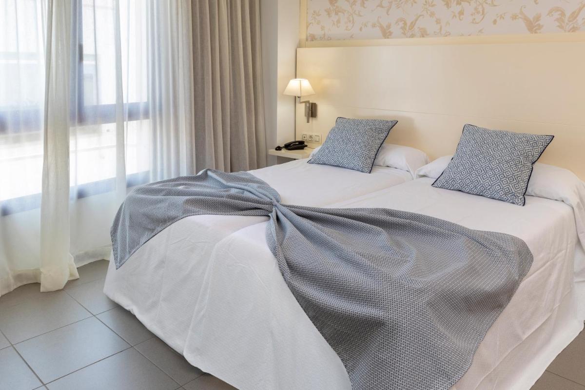 Cama o camas de una habitación en Hotel Spa Cap de Creus