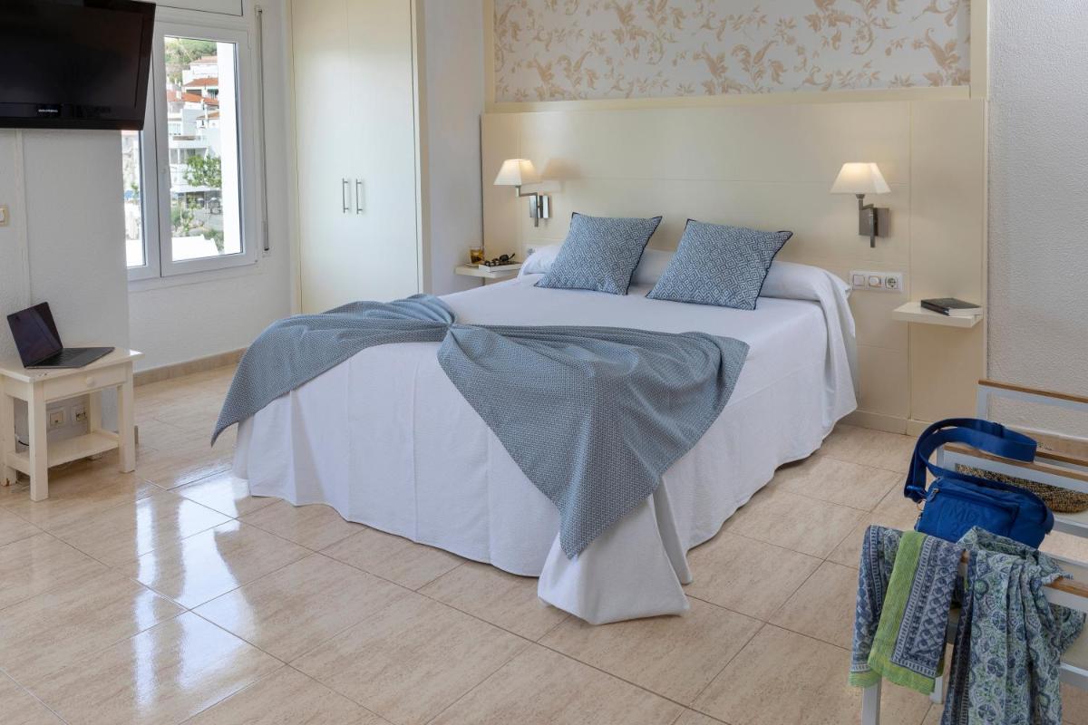 Cama o camas de una habitación en Hotel Spa Cap de Creus
