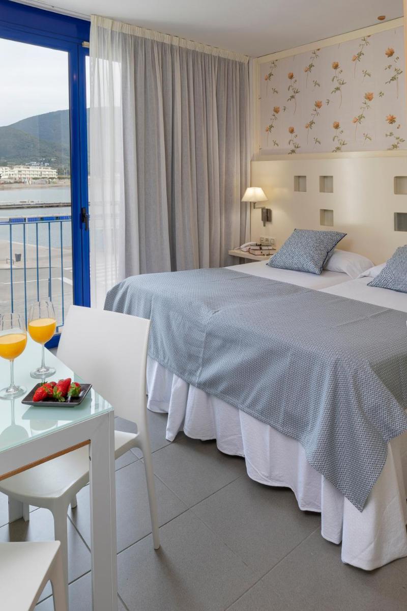 Cama o camas de una habitación en Hotel Spa Cap de Creus
