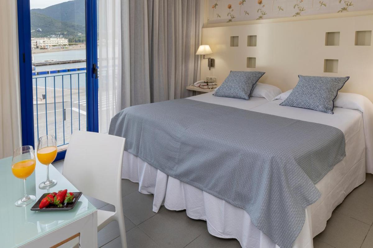 Cama o camas de una habitación en Hotel Spa Cap de Creus