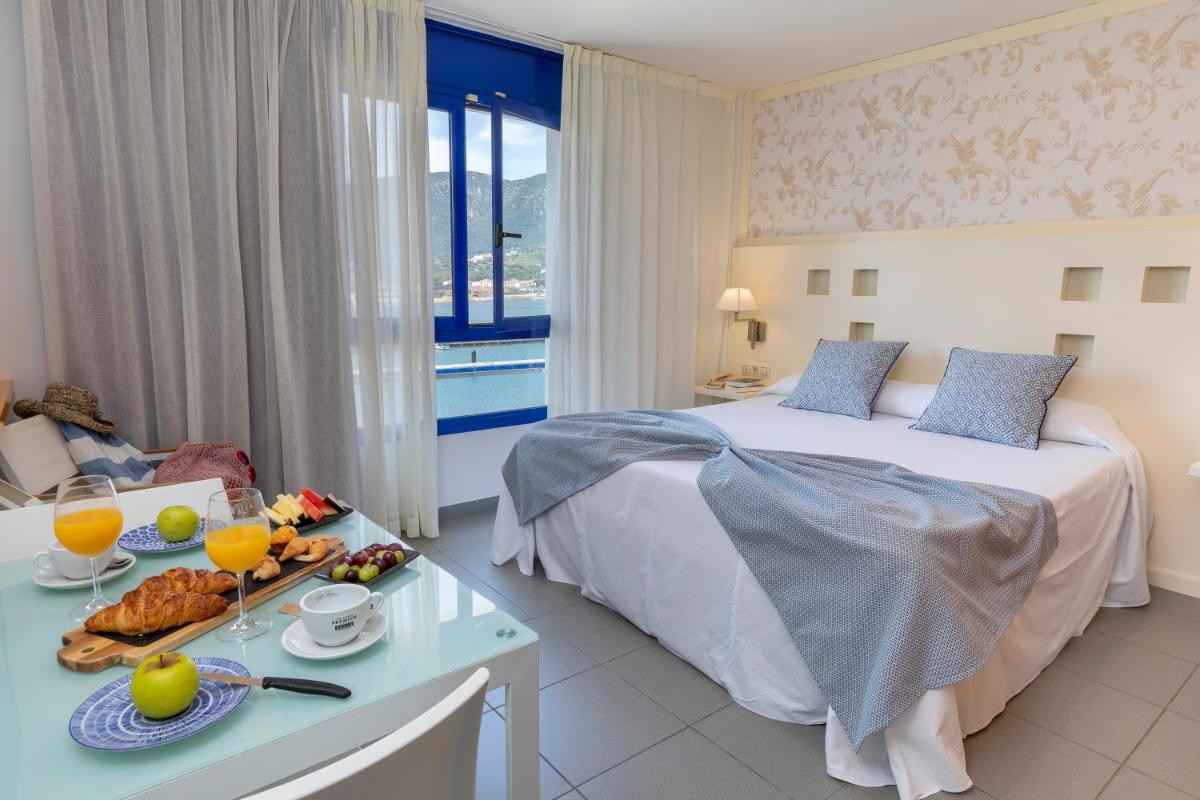Cama o camas de una habitación en Hotel Spa Cap de Creus