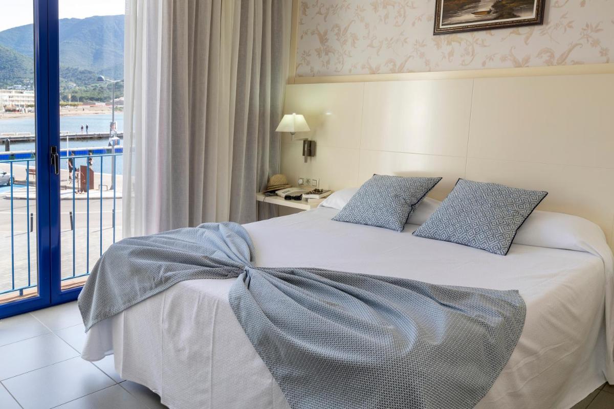 Cama o camas de una habitación en Hotel Spa Cap de Creus