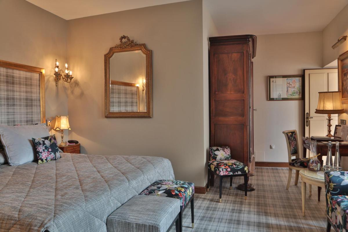 Un ou plusieurs lits dans un hébergement de l'établissement Hôtel Le Cep & Spa