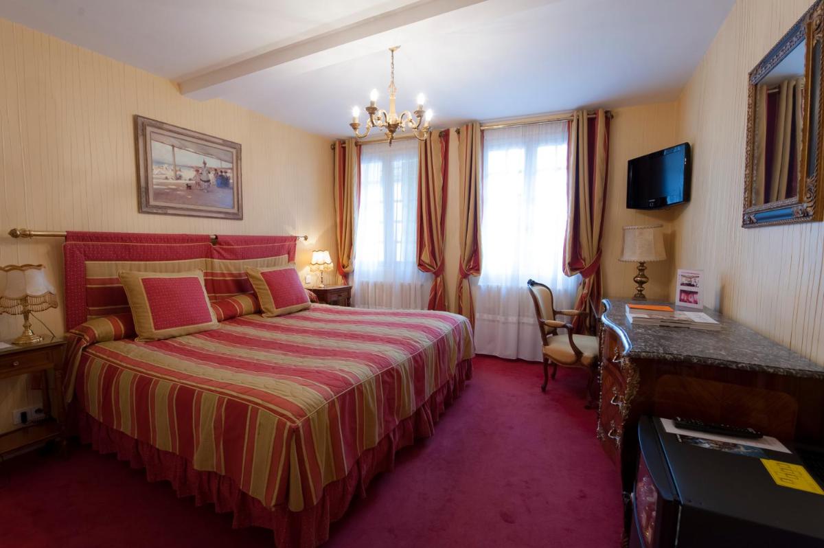 Un ou plusieurs lits dans un hébergement de l'établissement Hôtel Le Cep & Spa