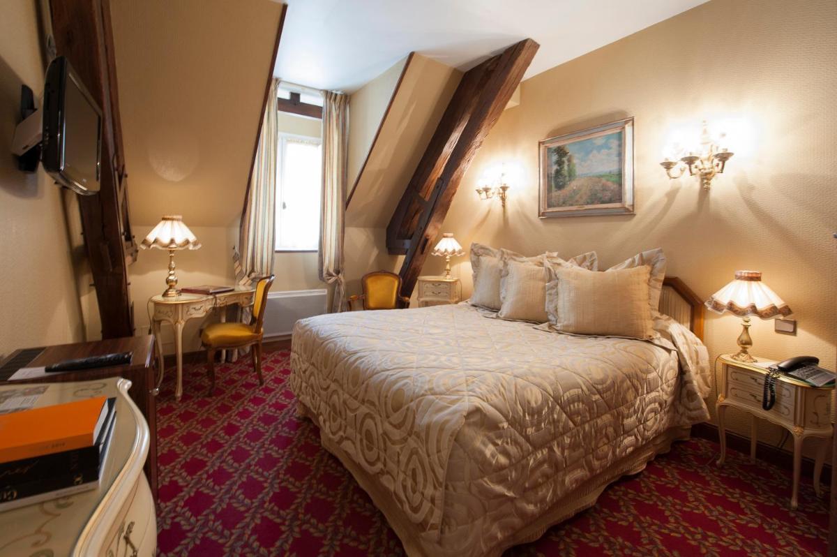 Un ou plusieurs lits dans un hébergement de l'établissement Hôtel Le Cep & Spa