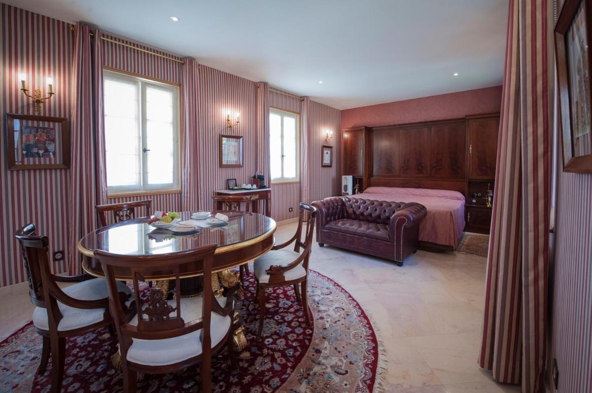 Un ou plusieurs lits dans un hébergement de l'établissement Hôtel Le Cep & Spa
